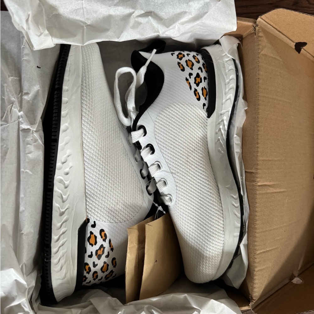 Stylish White and Black Cycling Shoes with Leopard Accents
